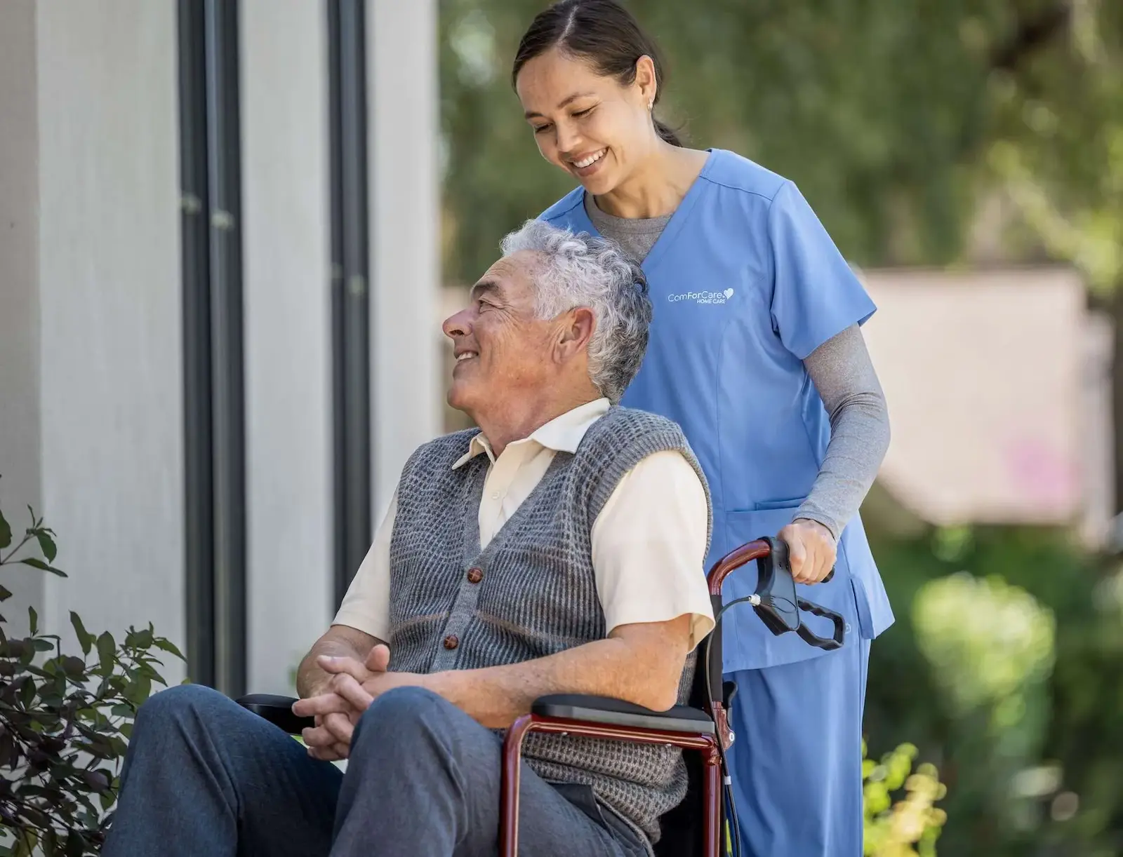 Senior Care Professional assisting an elderly man